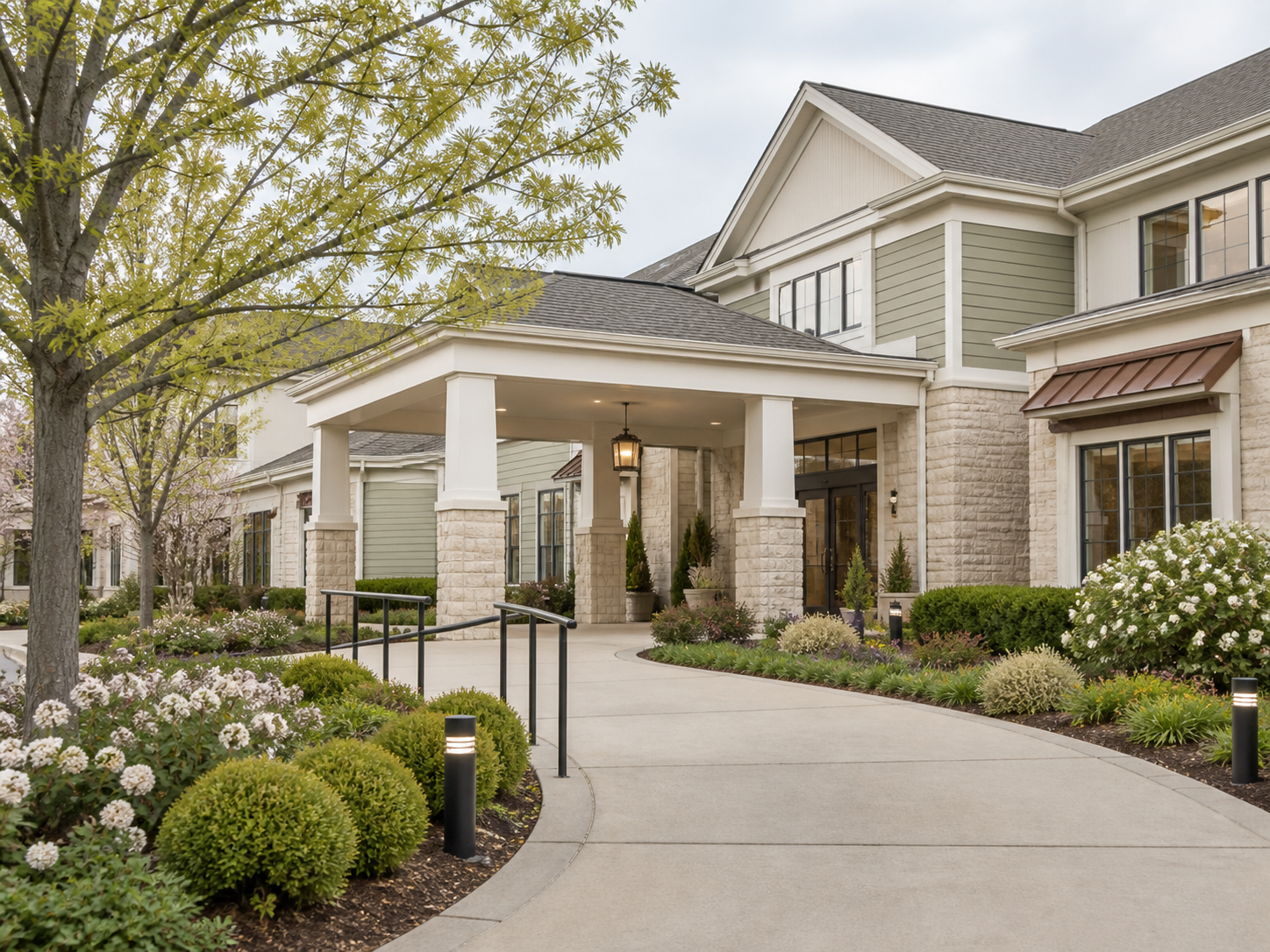 Welcoming senior living community entrance with accessible walkway and landscaped gardens